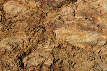 Brown natural stone texture background. Selective focus.