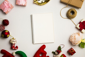 Notebook with golden leave, Christmas, gift box over the white background. 