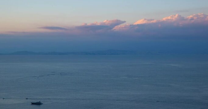 Evening time lapse overlooking the bay of Naples from the island of Capri