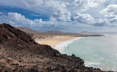 Hiking in La Graciosa Island, Canary Islands. View of the virgin beaches.