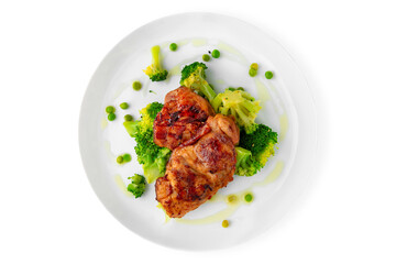 Steak with chicken or turkey with vegetables. Balanced, nutritious, tasty and nutritious food. Ready-made menu for a restaurant or for delivery. Dish in a white plate isolated on a white background.