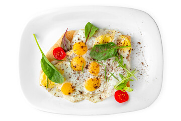 Breakfast of quail eggs with vegetables. Balanced, nutritious, tasty and nutritious food. Ready-made menu for a restaurant or for delivery. Dish in a white plate isolated on a white background.