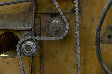 Old rusty agricultural machinery. Close-up Of Abandoned harvester, tractor