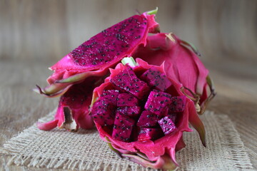 Cut red dragon fruit or pitaya known as ‘ejder meyvesi’ in Turkish. Close up, sitting view.