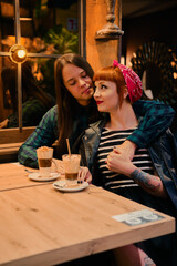 Stylish couple in love posing in a cafe. Online dating concept