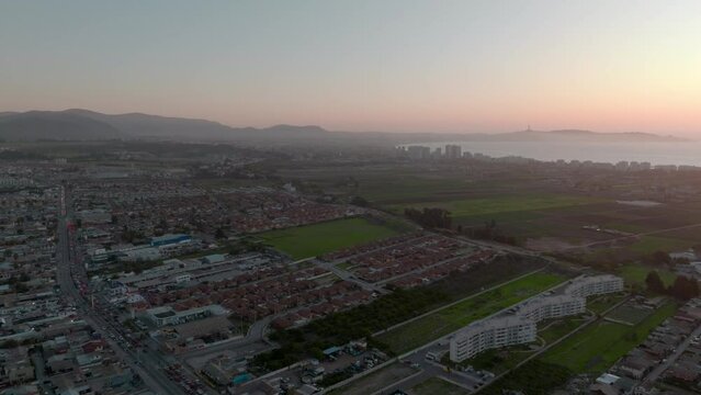 Panoramic aerial view of La Serena, Chile. Housing complexes and the mountains with the cross of Coquimbo in the background. Sunset