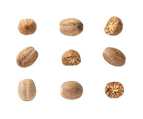 Set of whole and halved nutmeg seeds cutout. Organic muscat seeds variety isolated on a white background. Spice concept. Dry fruits of Myristica fragrans tree for herbal medicine and cooking. - obrazy, fototapety, plakaty