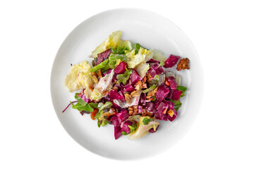 Vegetable salad with red cabbage and sun-dried tomatoes. Balanced, nutritious, tasty and nutritious food. Ready-made menu for a restaurant or for delivery. Dish in a white plate isolated on a white