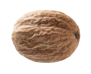 Natmeg seed macro cutout. Closeup of whole muscat nut isolated on a white background. Spice and...