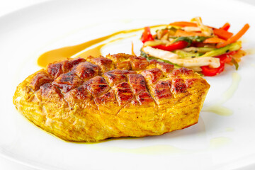 Steak with chicken or turkey with vegetables. Balanced, nutritious, tasty and nutritious food. Ready-made menu for a restaurant or for delivery. Dish in a white plate isolated on a white background.