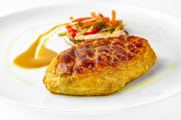 Steak with chicken or turkey with vegetables. Balanced, nutritious, tasty and nutritious food. Ready-made menu for a restaurant or for delivery. Dish in a white plate isolated on a white background.