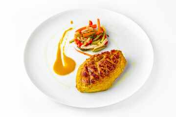 Steak with chicken or turkey with vegetables. Balanced, nutritious, tasty and nutritious food. Ready-made menu for a restaurant or for delivery. Dish in a white plate isolated on a white background.