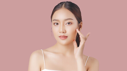 Close up perfect beauty face of young beautiful Asian woman massages her face gently with fingertips.