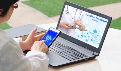 Adult woman using smartphone with laptop computer to scanning fingerprint for verify identity to access online medical healthcare service