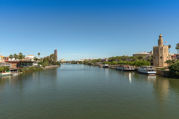 Fototapeta na wymiar View of the Guadalquivir River and the Torre del Oro, Seville, Spain