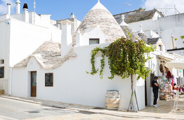 Shopping street with typical Trulli houses in Alberobello, Apulia, Italy.