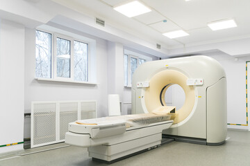 MRI machine in a hospital laboratory. Computed tomography room. General view of a huge tomograph in the hospital. - obrazy, fototapety, plakaty