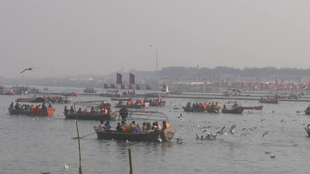 Pilgrims  And Boats With Flags at Kumbh mela