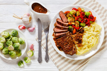 beef steak with potato mash and roasted vegetables
