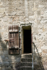 Fototapeta premium Old wooden door in the old wall.