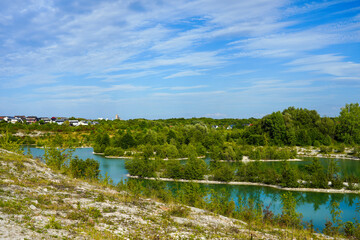 Obraz na płótnie Canvas View of the Dyckerhoff lake in Beckum. Quarry west. Blue Lagoon. Landscape with a turquoise blue lake and the surrounding nature. 