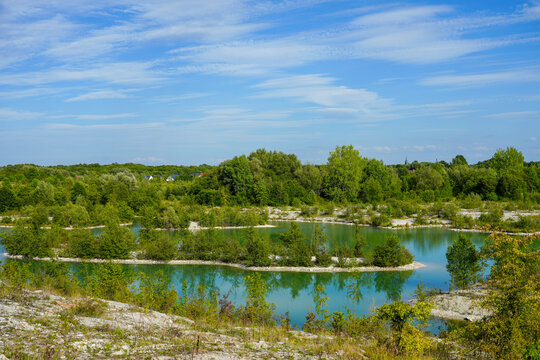View of the Dyckerhoff lake in Beckum. Quarry west. Blue Lagoon. Landscape with a turquoise blue lake and the surrounding nature.

