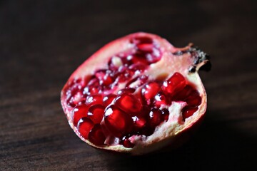 Close-up of half-cut pomegranate fruit