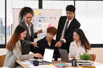 Fototapeta premium Diverse corporate colleagues brainstorming, meeting in modern office for new startup project together