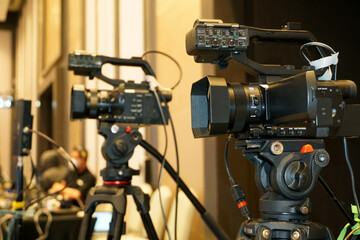 video camera broadcast on a tripod for corporate live streaming event