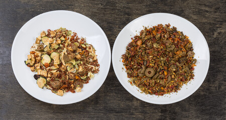 Two mixtures of spices and dried vegetables on two dishes
