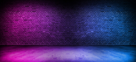 Black brick wall background with neon lighting effect from pink and purple to blue. Glowing lights in the dark on empty brick wall background