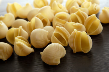 Closeup group of italian pasta Lumache with blurred background