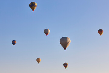 Spectacular balloons flying at sunrise in Goreme. Turism Cappadocia, Turkey