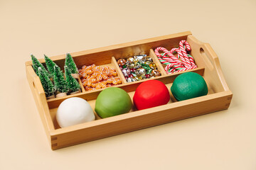 A DIY Christmas themed play dough kit complete with glitter and decoration. Sensory Busy Box. Holiday Art Activity for Kids. Sensory play for toddlers.