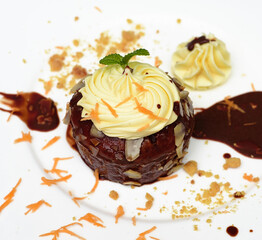 Carrot chocolate cake on plate and black background