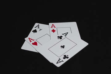 Playing cards aces on black