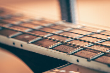 Fototapeta premium Guitar neck with a metal string, macro photography.