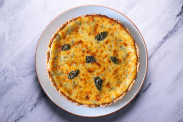 Flaó traditional dessert from Ibiza. The cheesecake is a unique combination of flavors — anise and mint.  The filling is made from fresh cheese (or ricotta and mascarpone), eggs and chopped mint