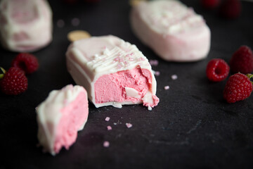 Raspberry Cheesecake with pink sugar sprinkles in the form of popsicle ice cream