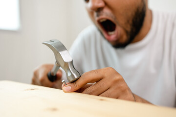 The carpenter was injured by hammer and nails. He misused the hammer and stuck it in his hand. Accidents during work require accident insurance.