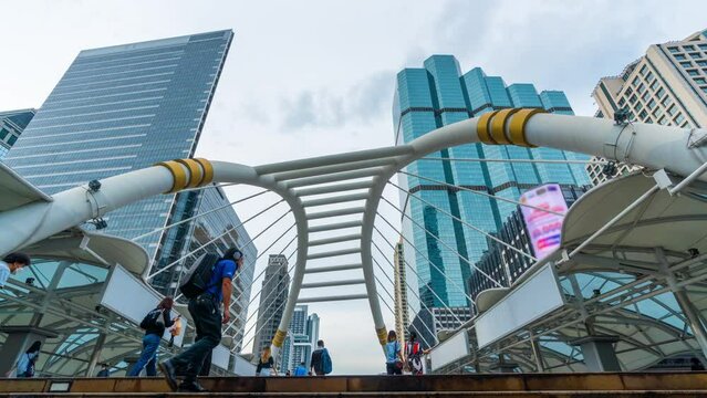 Time lapse of People walking on the skywalk in Bangkok, Thailand.