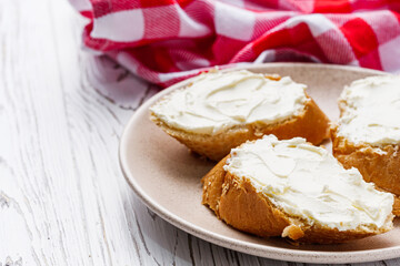 baguette cream cheese sandwich on a white background