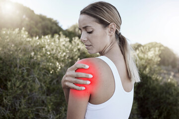 Fitness, woman and shoulder injury, pain or joint inflammation holding sore area in nature...