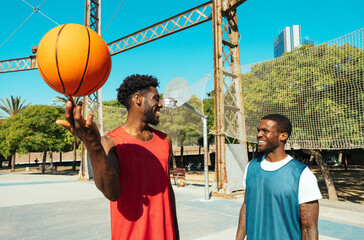 One vs one basketball game training at the court. Cinematic look image of friends practicing shots...