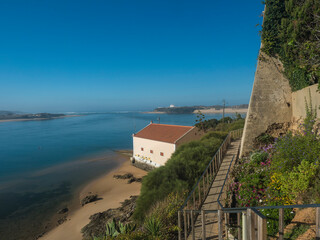 Idyllic view of the mouth of Mira river flowing into the Atlantic Ocean with stairs leading to port...