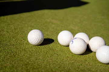 Field Hockey Balls on a Green Pitch