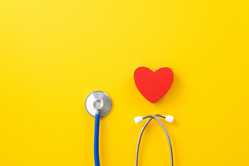 Blue stethoscope with red heart, medical care design concept.