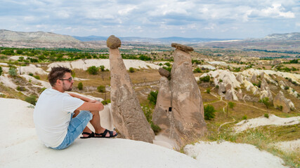 Pasabag Monks Valley happy young menon vacation in Turkey Cappadocia, Rock Formations in Pasabag...