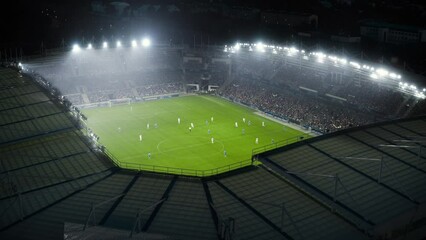 Aerial Establishing Shot of a Whole Stadium with Soccer Championship Match. Teams Play, Crowds of Fans Cheer. Football Tournament, Cup Broadcast. Sport Channel Television Playback, Screen Content