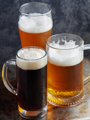 Three beers on the table. Various draft beer